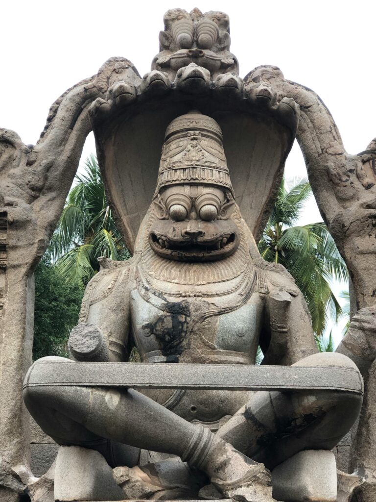 Explore the iconic Lakshmi Narasimha statue, an ancient marvel in Hampi, India.