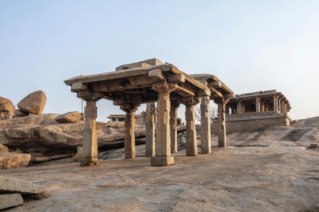Explore the ancient stone architecture of Hampi, a UNESCO World Heritage Site in India.